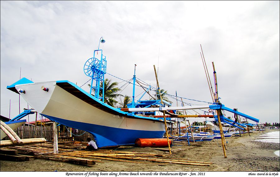 Renovation of fishing boats along Aroma Beach