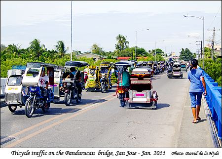 Tricycle traffic on the Pandurucan bridge, San Jose, Mindoro