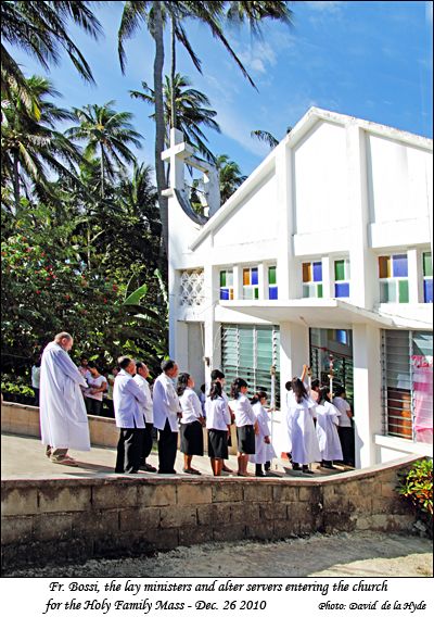 Father Bossi, the lay ministers and the alter servers entering the church for the Holy Family Mass