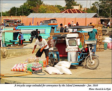 Goods unloaded from a tricycle for transport by the Island Commander
