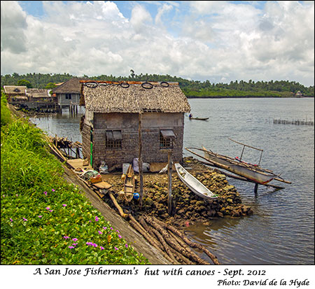A San Jose fisherman's hut and canoes