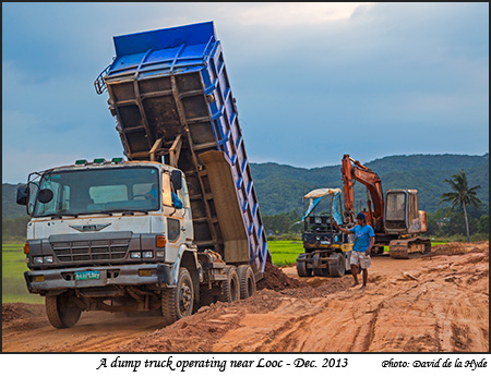 A dump truck operating near Looc