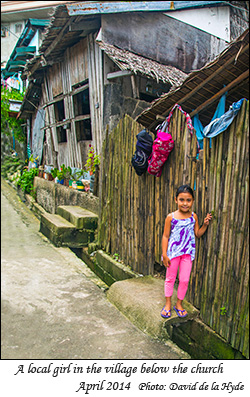 A local girl in the village below the church