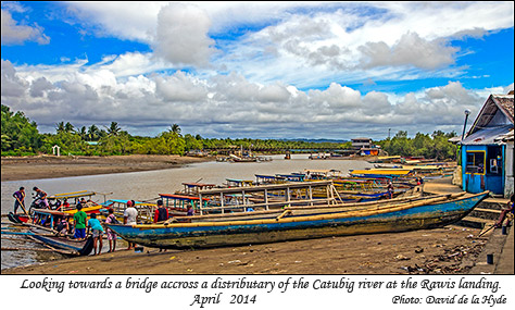 Looking along a distributary of the Catubig river towards a bridge crossing