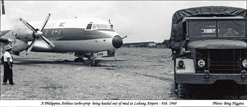 A Philippine Airlines Turbo-prob being hauled out of mud at Lubang Airport - February 1968