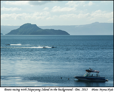 Boats racing with Napayung Island in the background
