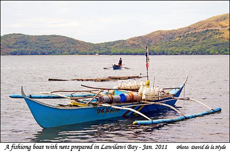 A boat with fish nets prepared in Lawilawi Bay, Ambil Island