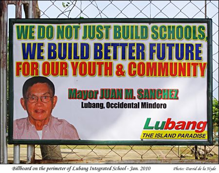A billboard on the perimeter of the Lubang Integrated School