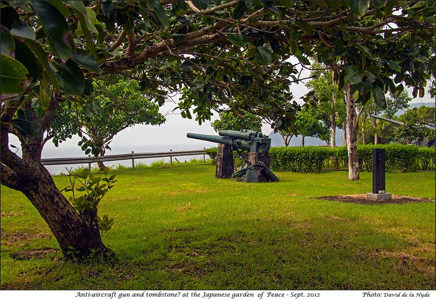 Anti-aircraft gun and Tombstone at the Japanese Garden of Peace