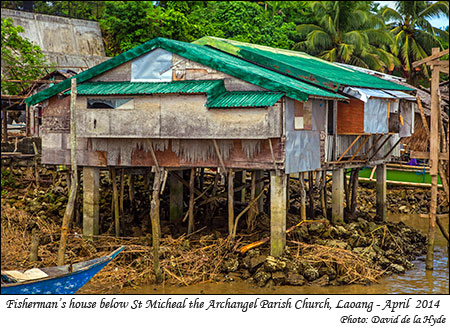 A fishermans house below the St. Michaelthe Archangel Parish Church, Laoang,Nothern Samar