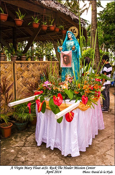 St Mary with a picture of Christ - St. Rock the Healer Mission Center